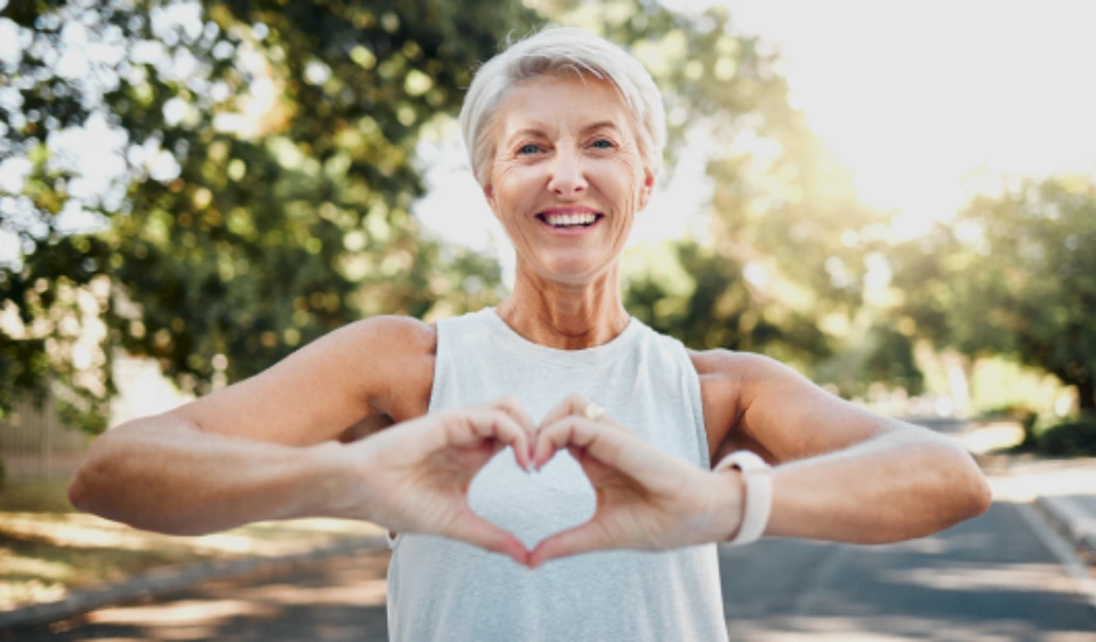 A woman lying down receiving a facial treatment.